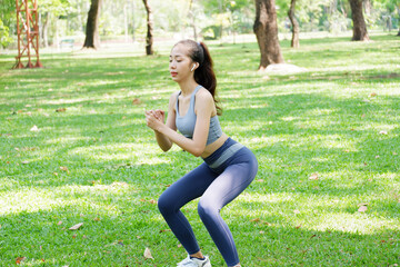 Woman doing yoga exercise in the park exercise concept health care.