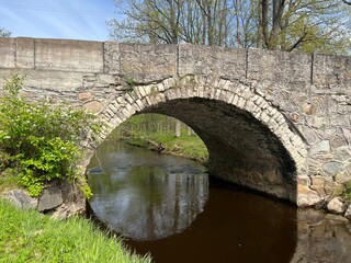 Obraz premium landscape with an arched bridge, it is the oldest arched bridge in Latvia. Built around 1860.