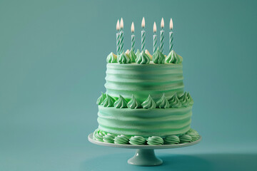 a green cake with candles on top of it