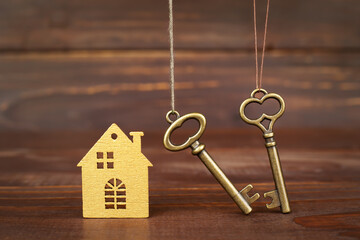 House and keys, buying, selling or renting home. Loan. Real estate background.