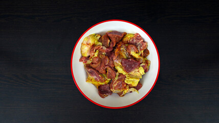 A sheet is prepared for cooking raw beef