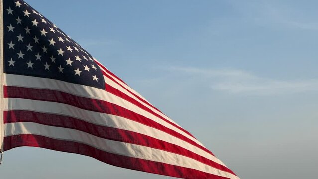 4th of July, Independence Day. American USA flag waving in sunset outdoor background for USA military. Concept of 4th of July, Independence Day, Veteran Day, Holiday, Celebration, Memorial Day 