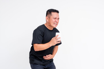 Middle-aged Asian man expressing discomfort while holding toilet paper, isolated on white