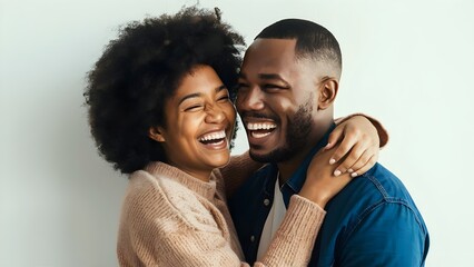 Obraz premium Joyful couple embracing and laughing together
