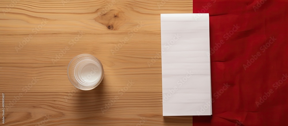 Poster Top down view of a wooden table displaying a paper napkin adorned with a phone number and a lipstick mark Ample space is available for text in this image