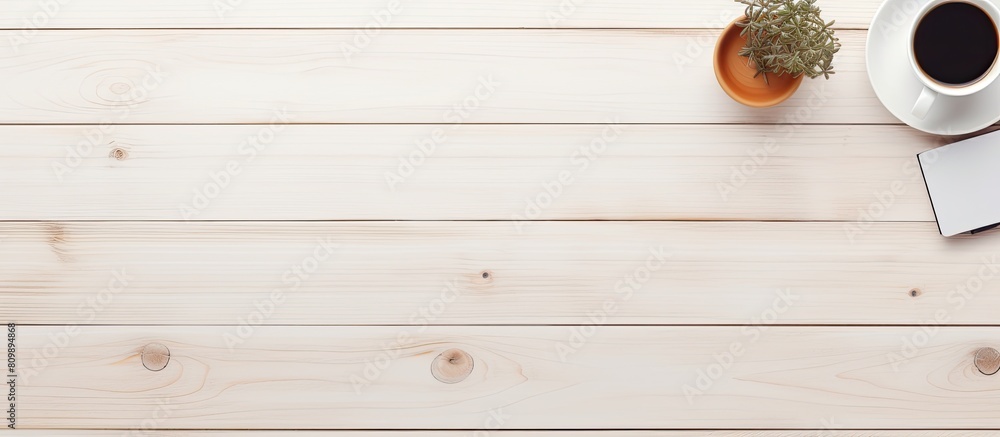 Leinwandbilder The top down view of a white wooden office desk with equipment for working accompanied by a cup of black coffee and a blank board for your message in a flat and minimalistic style A perfect copy spac
