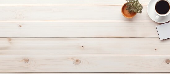 The top down view of a white wooden office desk with equipment for working accompanied by a cup of black coffee and a blank board for your message in a flat and minimalistic style A perfect copy spac