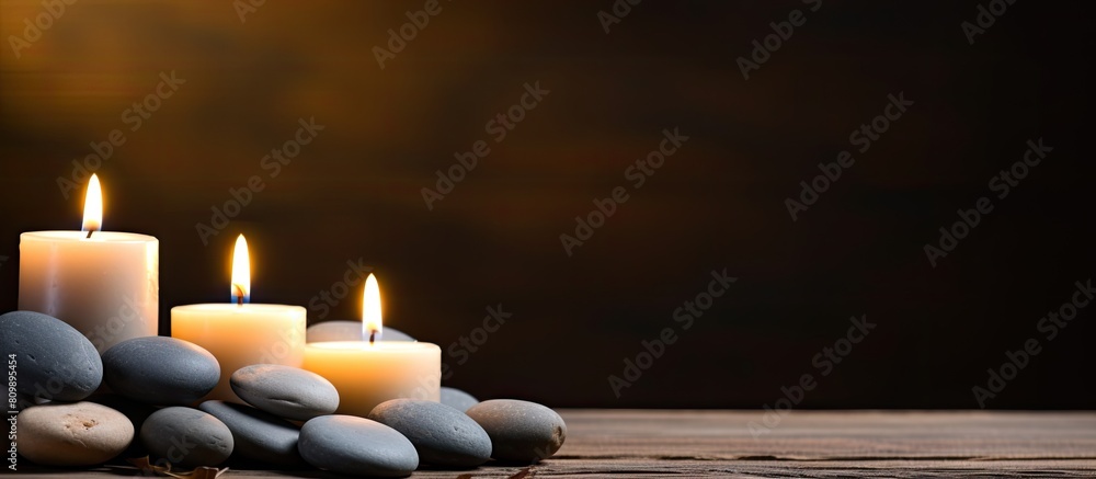 Aufkleber a serene arrangement of candles and spa stones on a wooden background perfect for a calming ambiance
