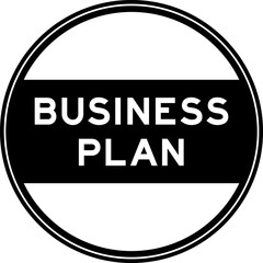 Black color round seal sticker in word business plan on white background