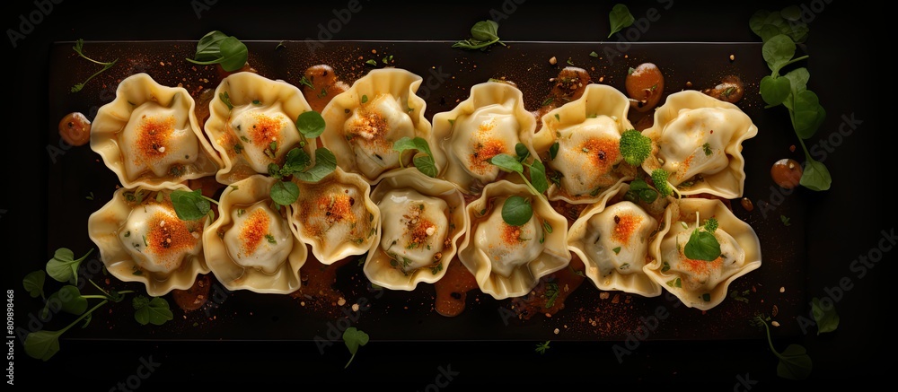Poster The menu concept features tortellini with filling also known as ravioli dumplings on a food background It is presented in a top view with copy space