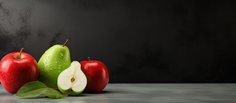 A diet fruit concept featuring green and red apples along with a white pear on an iron background creating a visually appealing copy space image