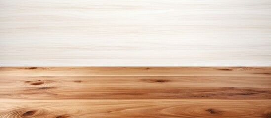 A brown wooden tabletop is situated on a white background with plenty of space for images. Creative banner. Copyspace image