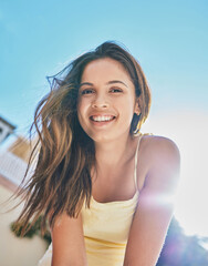 Summer, happy and girl outdoor with portrait for warm weather on vacation for leisure or relaxation, road trip and journey. Woman, sunny and holiday in Columbia for adventure, travel and break.