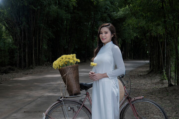woman with in Vietnam traditional with  bicycle.
