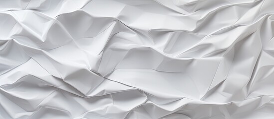 Obraz premium The crumpled white paper texture background serves as an abstract canvas providing copy space for adding text or graphic design elements