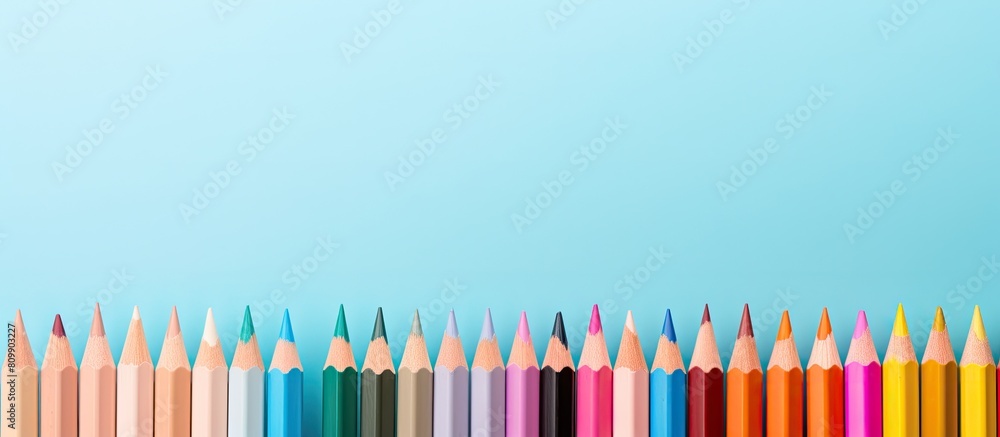 Poster a vibrant arrangement of colored pencils against a pastel backdrop creating a visually captivating c