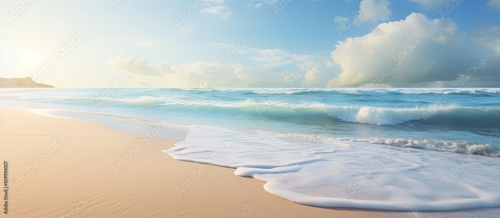 Poster a serene beach scene with sandy shore and gentle waves creating a peaceful morning ambiance perfect 
