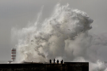 People photographing during sea storm
