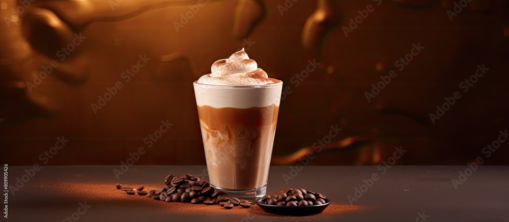 Poster a milk chocolate cocktail or whipped coffee with milk and ice adorned with cocoa powder on a contras