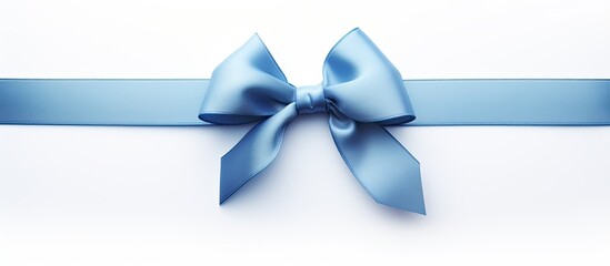 A blue gift ribbon with a parallel ribbon forming a bow on a white background The image has copy space