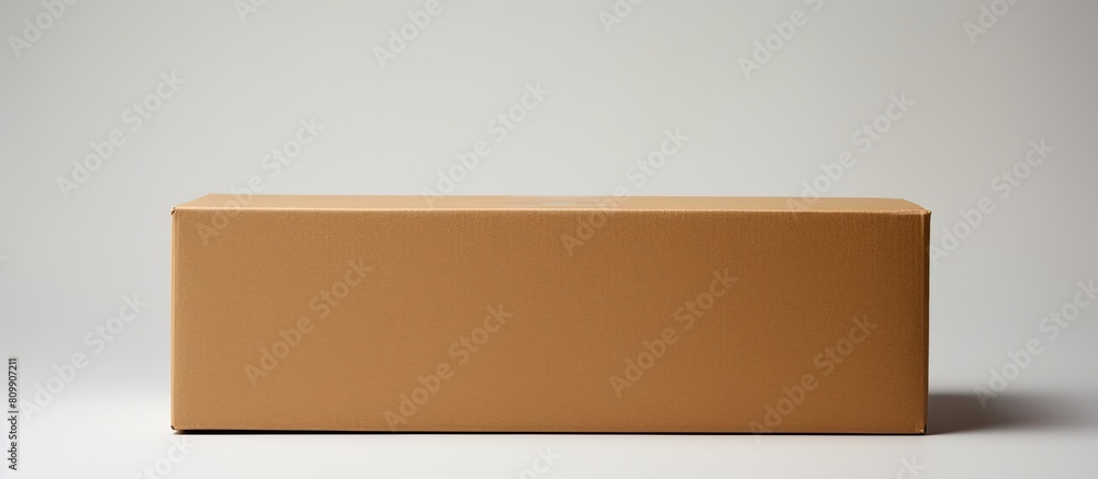 Aufkleber a closed cardboard box with ample white space in the background