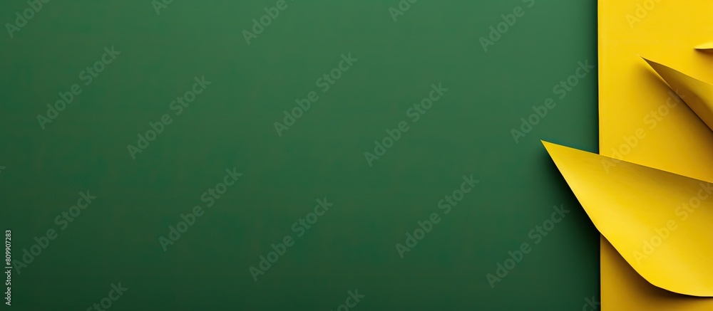 Poster top view of a vibrant green and yellow paper background with ample copy space for adding images or t