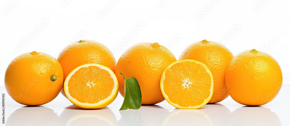 Poster A citrusy delight freshly cut oranges placed on a pristine white backdrop ready for center stage Ample empty space is available for creative use