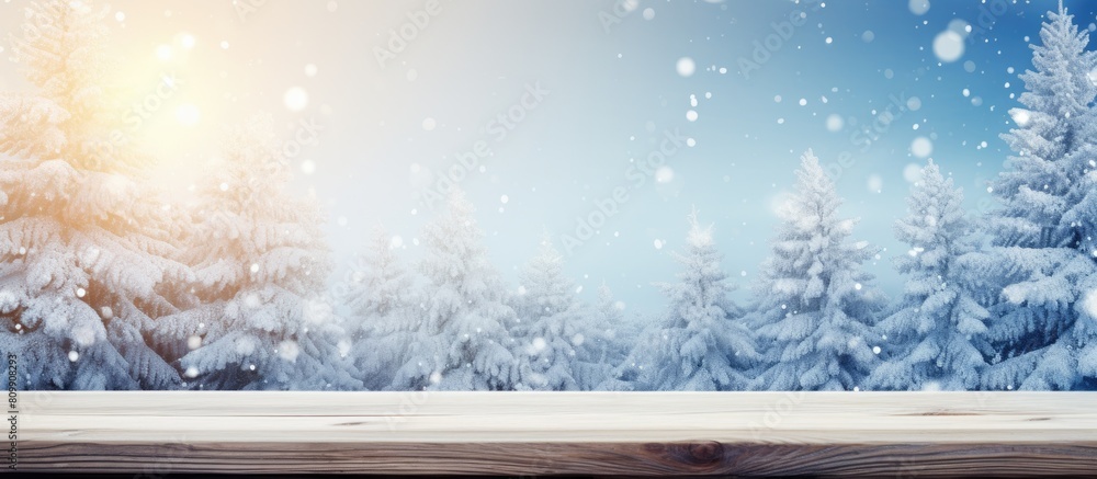 Poster a wintry christmas background featuring a snowy landscape with fir branches the wooden table is plac