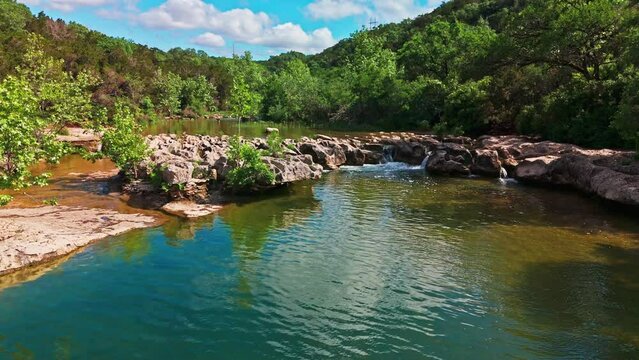 Scenic aerial view of Sculpture Falls via Barton Creek Greenbelt Trail in Austin Texas at summer