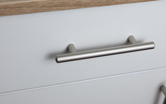 White cabinet or chest of drawers close-up