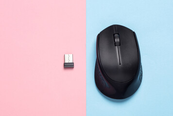 Wireless PC mouse with USB flash drive on pink blue background