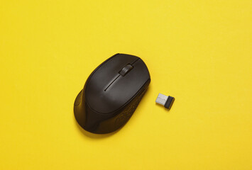 Wireless PC mouse with USB flash drive on yellow background