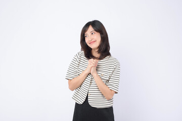 Asian woman is expressing delight against a white background.