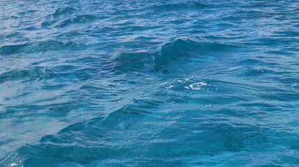 Pristine crystal clear turquoise blue sea water of th Caribbean Atlantic ocean flowing with waves 