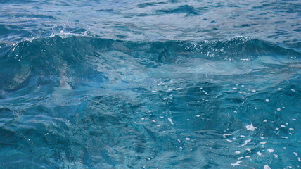 Pristine crystal clear turquoise blue sea water of th Caribbean Atlantic ocean flowing with waves 