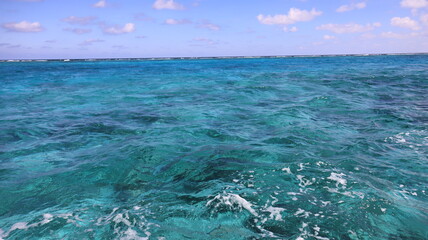 Cayman Islands Pristine crystal clear turquoise blue sea water of the Caribbean Atlantic Ocean flowing with waves 