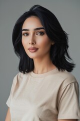 Portrait of arabic woman with black hair wearing a beige t-shirt