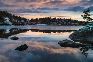 Snow-Covered Hills Surrounding a Body of Water - Powered by Adobe