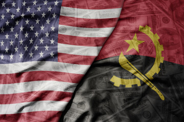 big waving colorful flag of united states of america and national flag of angola on the dollar...