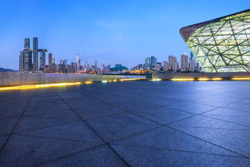 Empty square floors and modern city buildings at night in Chongqing