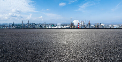 Asphalt road square and refinery chemical plant in industrial area. Panoramic view.