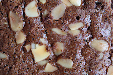 Close up texture of brownies cake upper skin with almond topping
