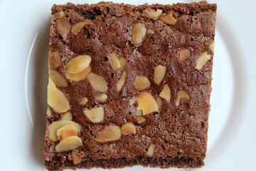 Brownies cake with almond topping, big square cut, flat lay or top view