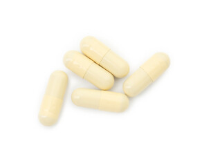 Vitamin capsules isolated on white, top view. Health supplement