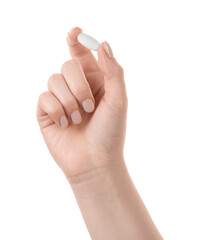 Woman holding vitamin pill on white background, closeup. Health supplement