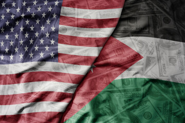 big waving colorful flag of united states of america and national flag of jordan on the dollar money background. finance concept.