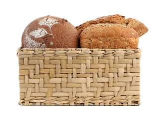 Basket with different types of fresh bread isolated on white