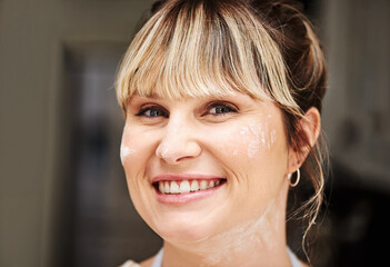 Woman, portrait and smile for flour on face in kitchen, recipe and catering as baker in Germany....