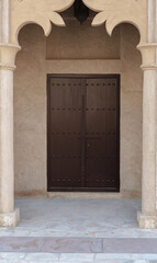 An old classic Arabic style wooden door in Al Fahidi Historical Neighbourhood