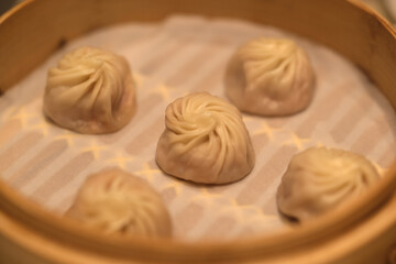 close up several soup buns (Tangbao) in steamer. Chinese dim sum food